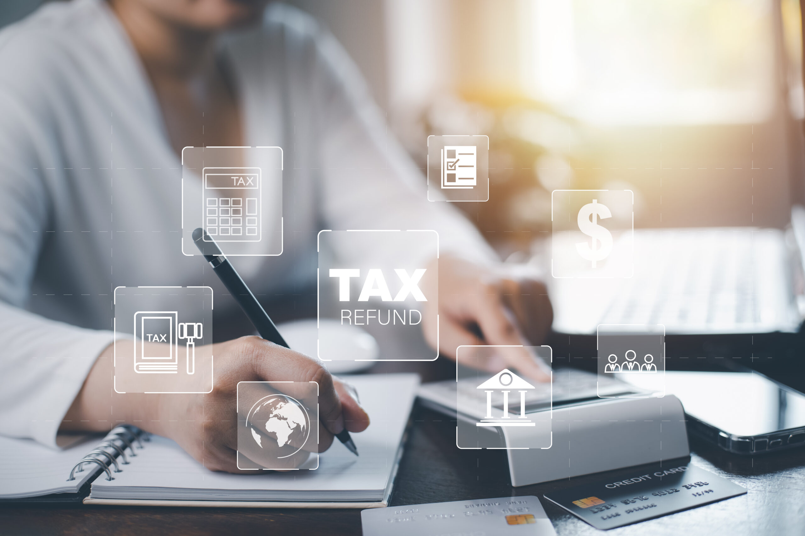 Small business owner using MTD-compatible accounting software on a laptop.