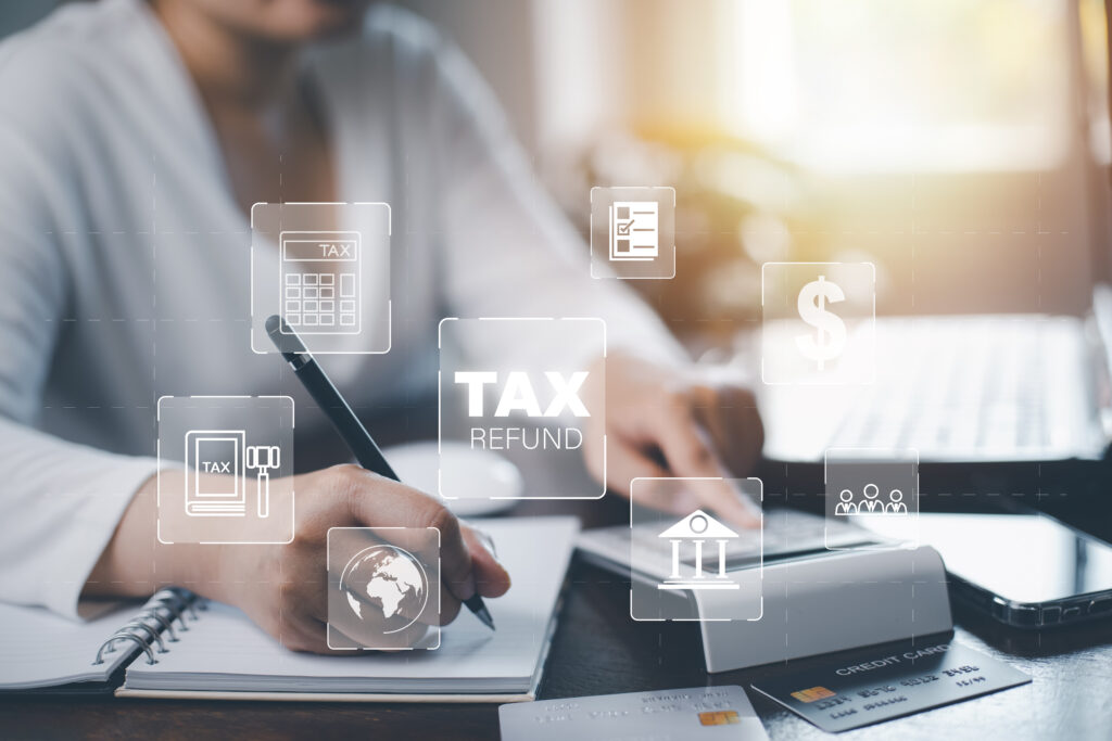 Small business owner using MTD-compatible accounting software on a laptop.