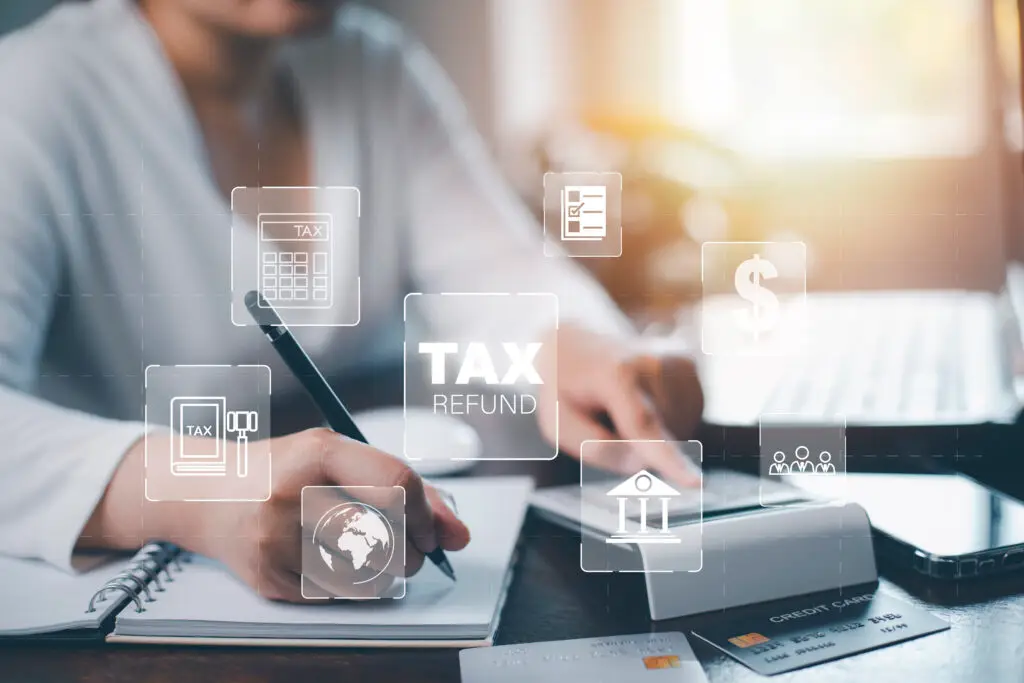 Small business owner using MTD-compatible accounting software on a laptop.